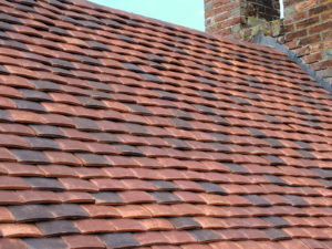 Roof with different coloured tiles