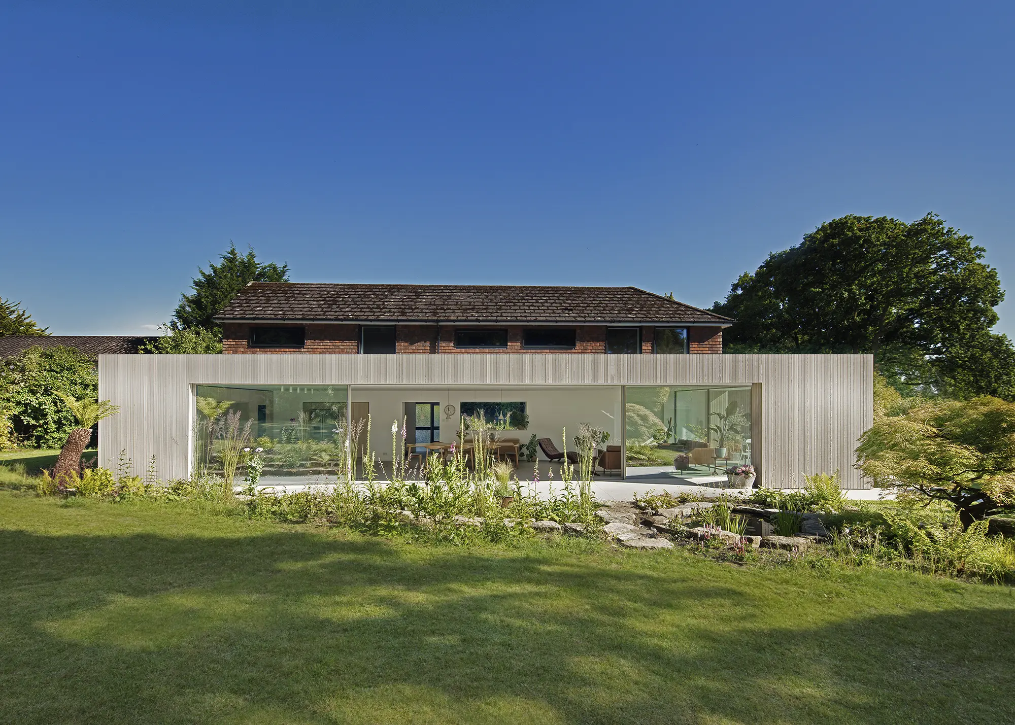 Mid-Century Home Upgraded with a Timber-Clad Home Extension